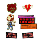 All six pins in The Ye Collection: Graduation Bear 2.0, Late Registration Bear, red Heartless, Just Ye, Old Kanye, and New Kanye, shown in proportion to their listed sizes.